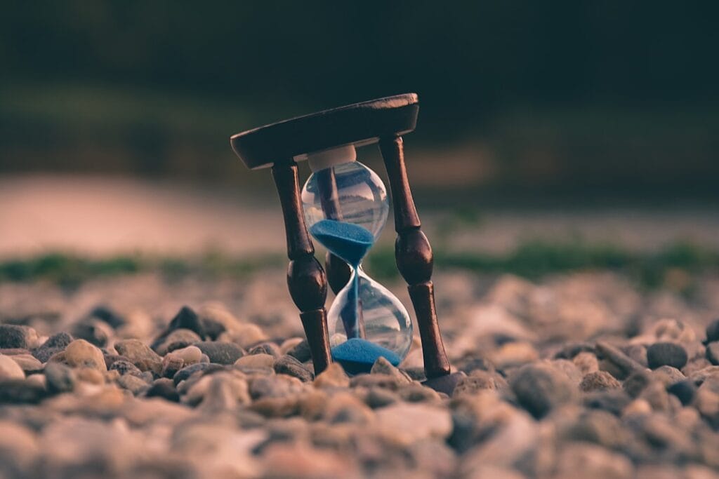 Google Drive Download Quota Exceeded: 3 Fixes Hourglass on pebbles representing the waiting period for Google Drive quota reset
