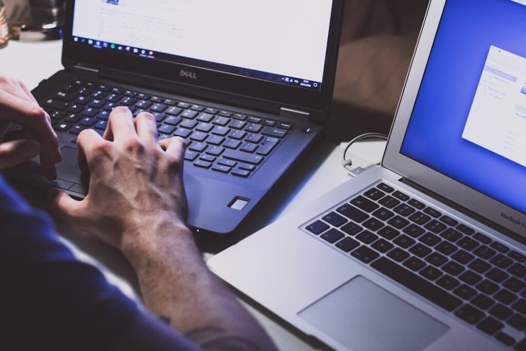 Google Drive Download Quota Exceeded: 3 Fixes Person using a laptop computer to download a file from Google Drive