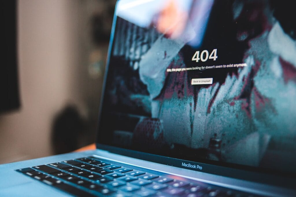 Laptop screen showing a 404 error message representing failed Google Drive downloads